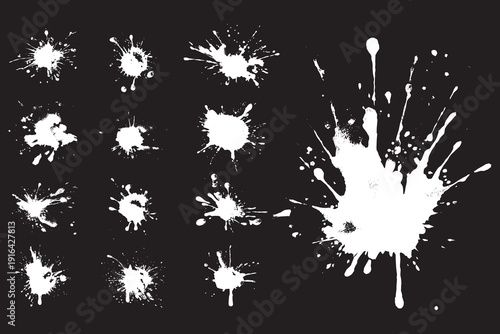 A set of chaotic spray paint splatters and droplets vector illustration.