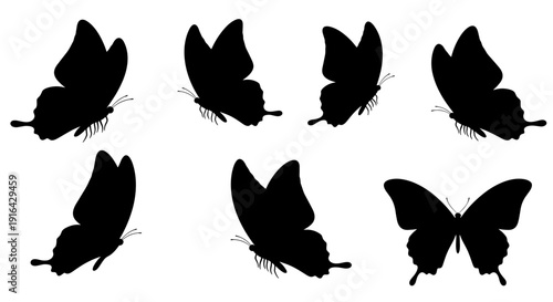 Black butterfly silhouettes arranged in a repeating pattern forming a decorative artistic motif.