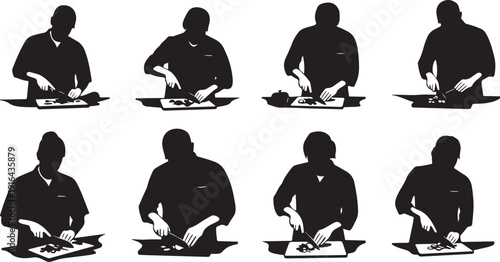 Silhouette of a man working on a laptop computer