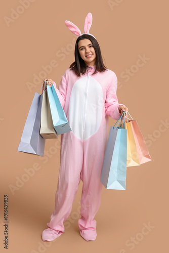 Happy young woman in bunny ...