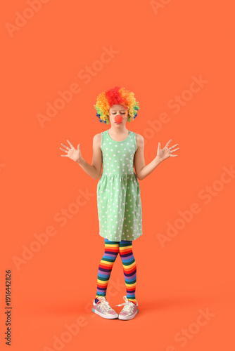 Funny girl in clown costume...