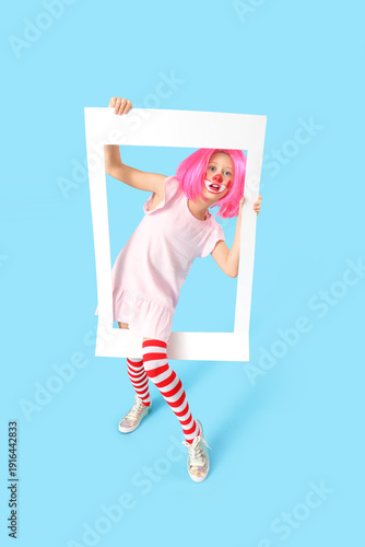 Funny girl in clown costume...