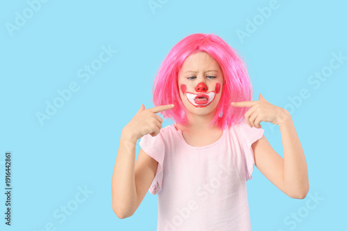 Funny girl in clown costume...