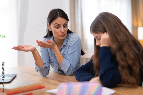 Mother experiencing frustration helping daughter with homework