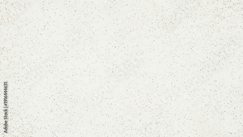 Close-up of a textured, light-colored surface resembling speckled quartz.