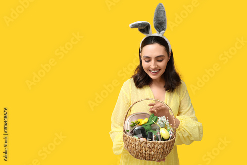 Young woman in bunny ears h...