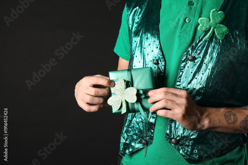 Young man with clover and g...
