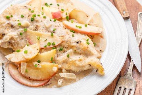 Bild auf Leinwand Sweet apple chicken dinner in a creamy onion sauce