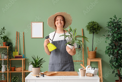 Smiling woman with spray bo...