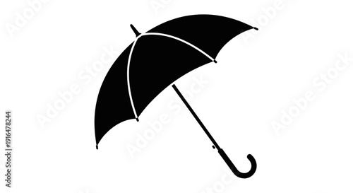 A simple black umbrella open and angled, providing protection from rain or sun.