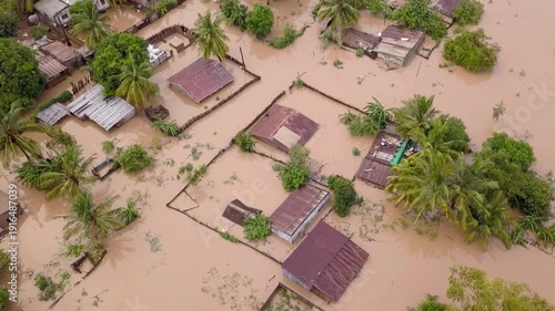 Aerial drone view of severe flooding in a residential village. heavy rain and sucked houses situation. Rain emergency  and heavy flood alarm.  