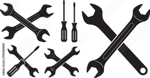 Collection of wrenches and screwdrivers on white background