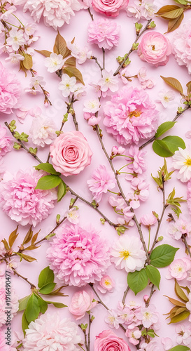 Delicate pink cherry blossoms, roses, and ranunculus flowers with green leaves arranged on a soft pastel background, creating a floral pattern for spring designs.