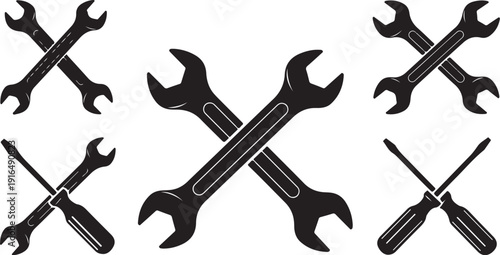 Black and white illustration of crossed wrenches and screwdrivers tools