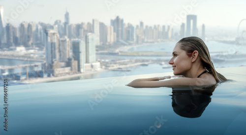 woman enjoying Dubai panorama from rooftop infinity pool. copy space