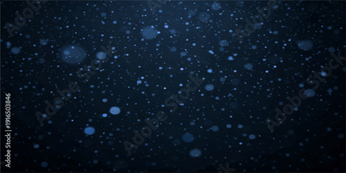 Blue rain drops on the window reflect a starry night sky where glowing light particles and winter snow dance across a dark cosmic background