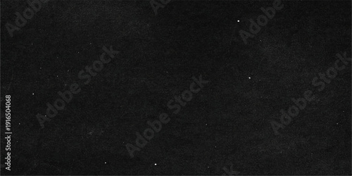 A dark grunge design featuring a rough black and white paint texture on vintage paper material with a macro grey pattern for a textured wall backdrop