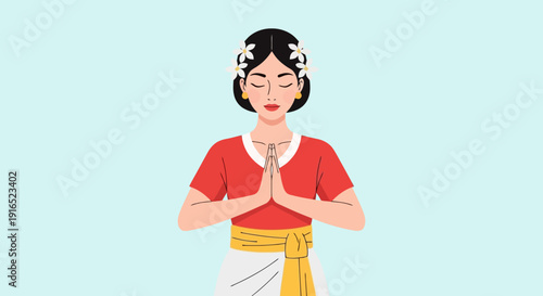 Woman in Traditional Attire Offering Namaste Gesture.