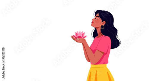 Woman holding a pink lotus flower with eyes closed.