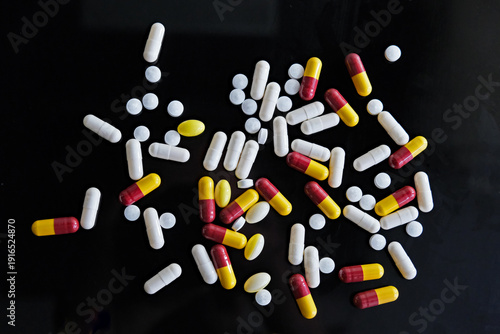 Slika na platnu Large number of multi coloured pills, tablets or capsules