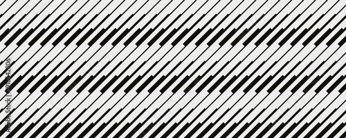 Abstract black and white diagonal zigzag pattern with sharp geometric lines repeating on light background. Minimal monochrome textile design of dynamic movement and modern geometry