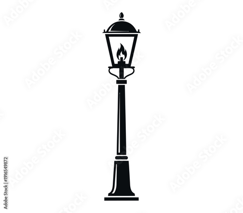 Black silhouette of a classic street lamp on a with flame