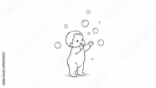 Happy baby reaching for bubbles with joy