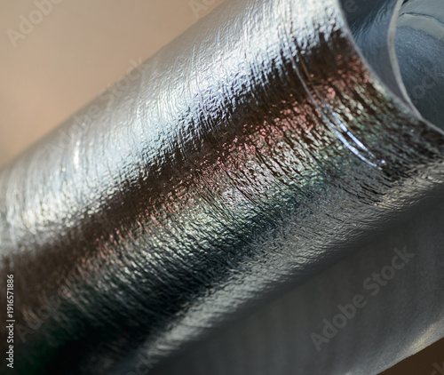 Abstract macro of shiny silver reflective insulation roll.