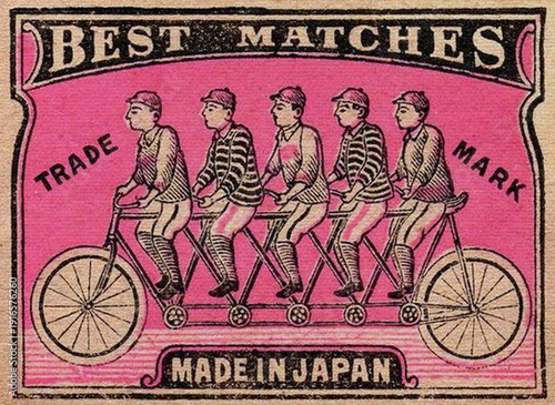 Φωτογραφία A vintage matchbox label features five boys in striped shirts and shorts riding a tandem bicycle