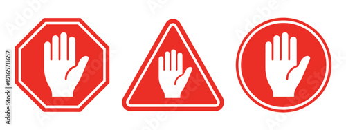 Three red stop signs featuring a white hand symbol indicating halt