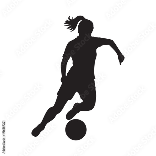 Silhouette of a female soccer player dynamically kicking a ball