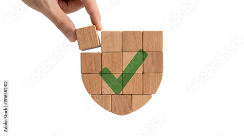 Hand Placing Wooden Block on Shield Shape with Green Checkmark Concept