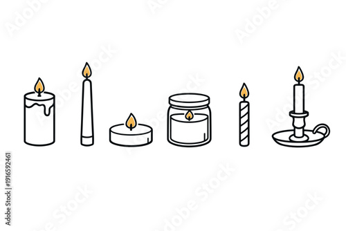 Collection of various burning candles in different shapes and sizes with flames