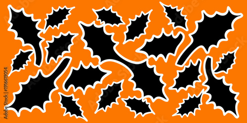 Halloween pattern of black bats on a vibrant orange background