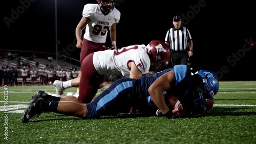 American Football Player Running With Ball During Night Game