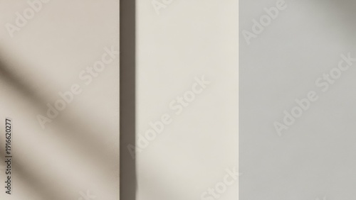 Softly lit cream and beige wall panels with subtle shadow creating a minimalist abstract backdrop