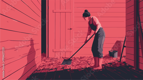 A person in overalls and boots sweeps autumn leaves near a wooden shed door