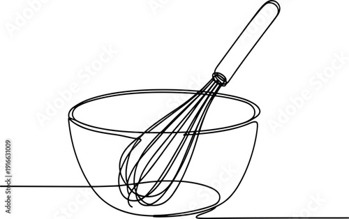 Wire Whisk Inside a Glass Bowl on a Flat Surface kitchen utensil cooking tool d