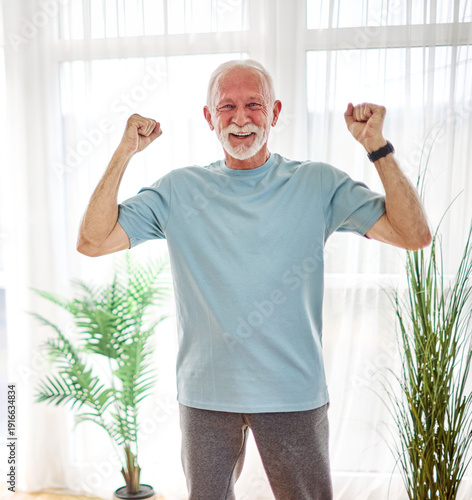 Wallpaper Mural Portrait of a senior elderly woman and man, a couple, exercising at home or in the gym, workout and training. Mature female and male person happy doing cardio exercise for health, exercising and stret Torontodigital.ca