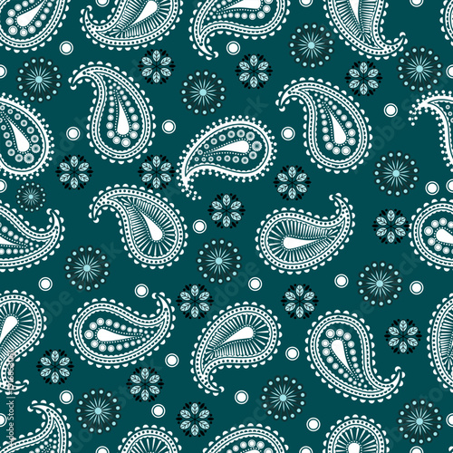 Seamless paisley pattern with delicate floral ornaments and dotted motifs in light tones on deep teal background. Ideal for textiles, wallpaper, fashion prints, packaging, and elegant surface design.
