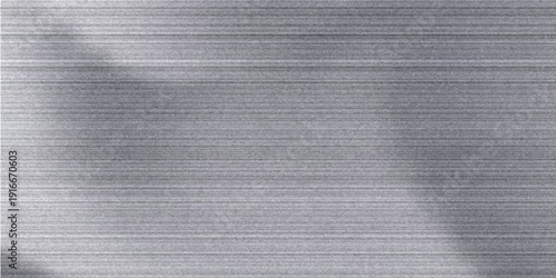 Silver metal texture of brushed stainless steel plate with the reflection of light.