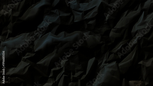 Crumpled dark paper texture with deep shadows and subtle sheen