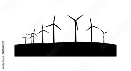 Silhouette of wind turbines on a hill