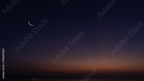 Crescent moon on dusk sky twilight after sundown, religion of Islamic well editing text Ramadan Kareem, Eid al Fitr, Eid Mubarak, Eid Al Adha, Muharram on free space backgrounds