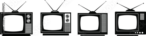 Four old black and white television sets with antennas