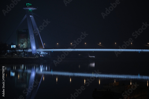 Sticker The iconic UFO bridge in Bratislava at night with reflection on the surface of t