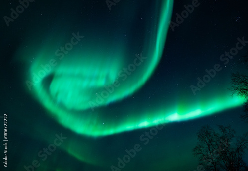 Bild auf Leinwand Green aurora spiral seen in Abisko National park in Sweden on a winter night