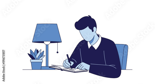 Young man writing in notebook while sitting at desk with lamp  