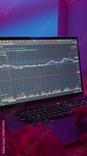 Trader Observes Market Patterns. Monitoring Market Trends With Moving Averages Attentively. Trader Carefully Observes Fluctuating Market Signals And Technical Indicators In Subdued Illumination