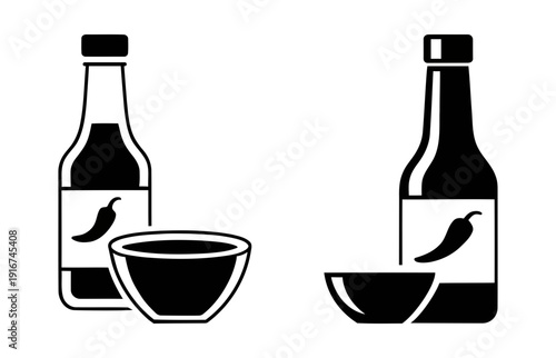 Bottles of soy sauce with dipping bowls and chili pepper